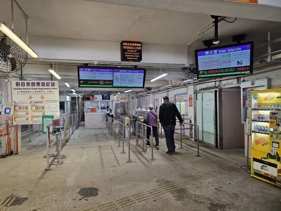 Boarding the ferry via turnstiles with Octopus Card